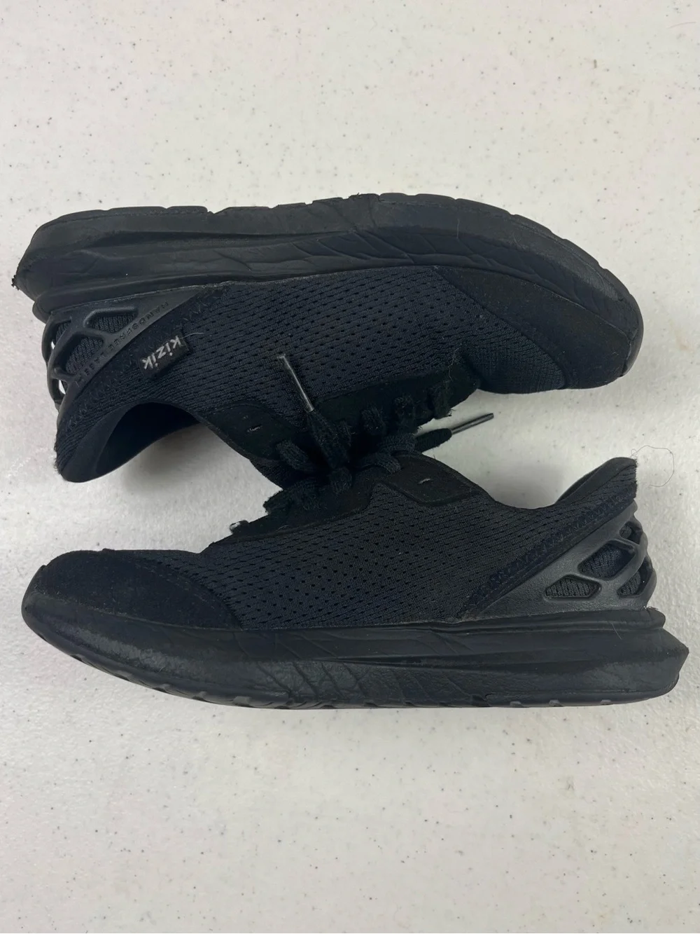 Kizik Kids All-Black Slip-On Athletic Shoe